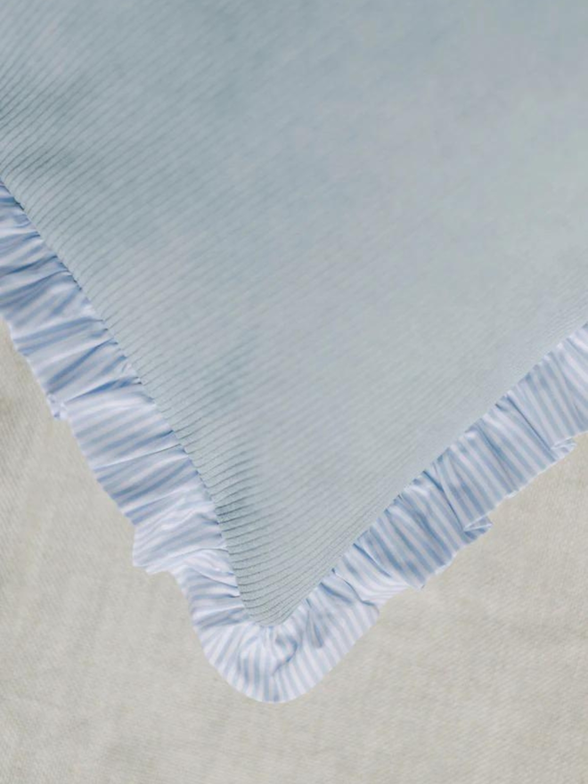 light blue corduroy and striped dog bed cushion