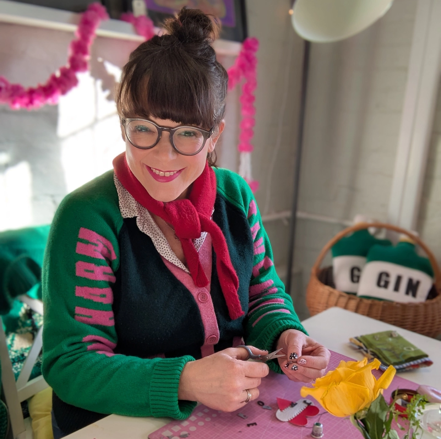 Zoe sewing heart keyrings in her New Forest studio