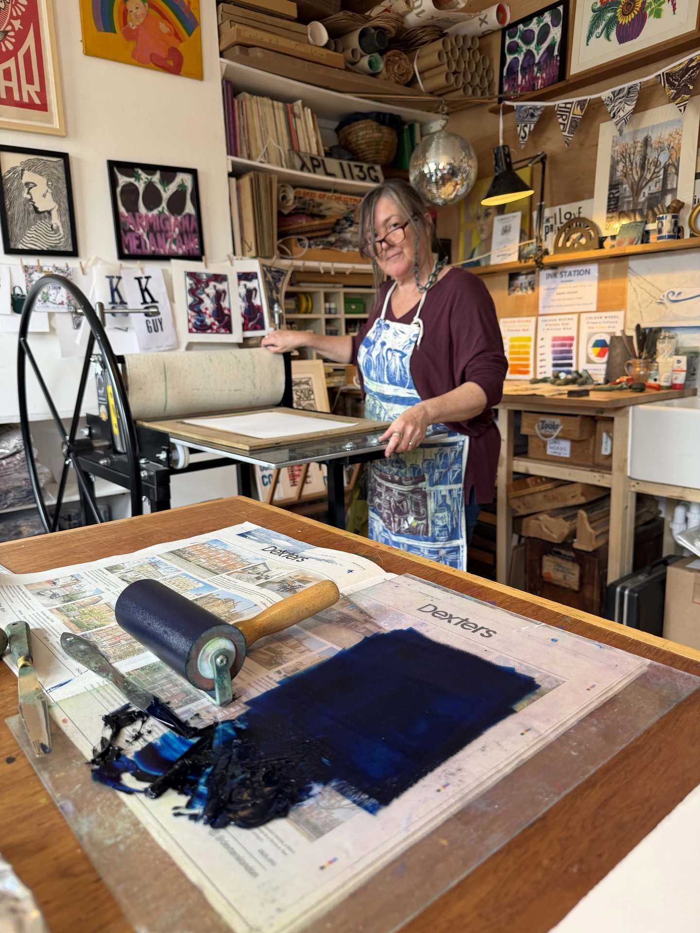 Kate Guy Linocut artist and designer in her studio