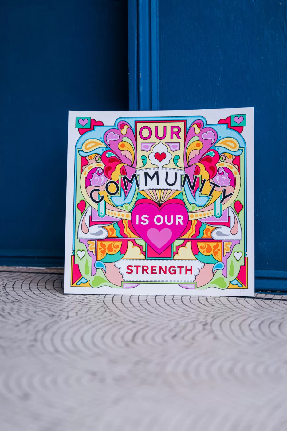 Our Community Is Our Strength Placard.