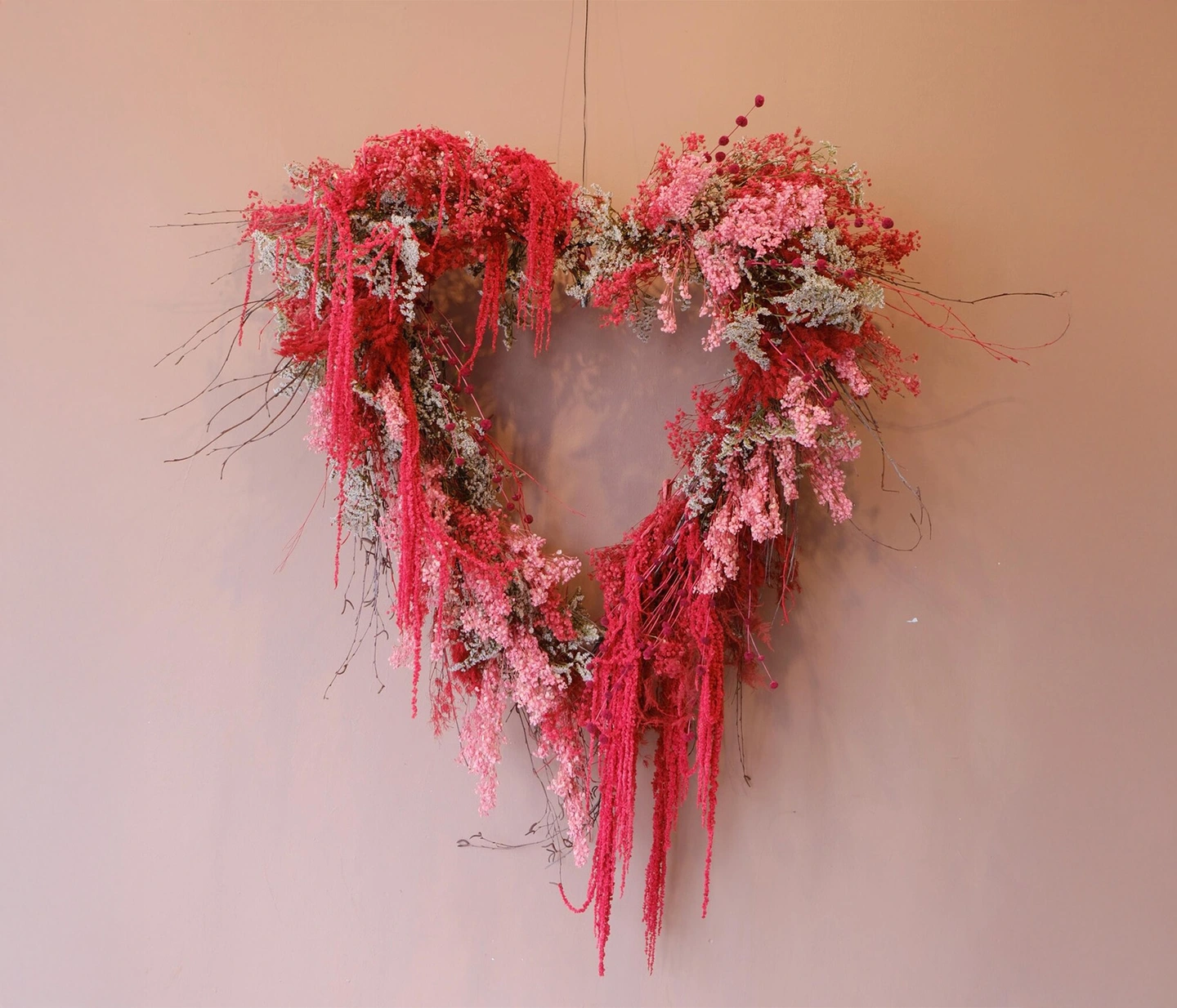 Giant heart wreath. A giant red and pink dripping everlasting wreath