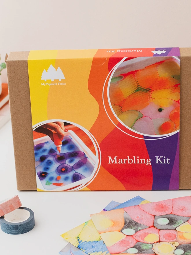 a marbling kit box and some marbling prints by my papercut forest