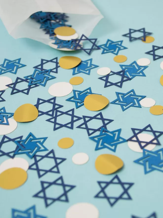 Confetti mix featuring two styles of blue six pointed star with gold and white dots