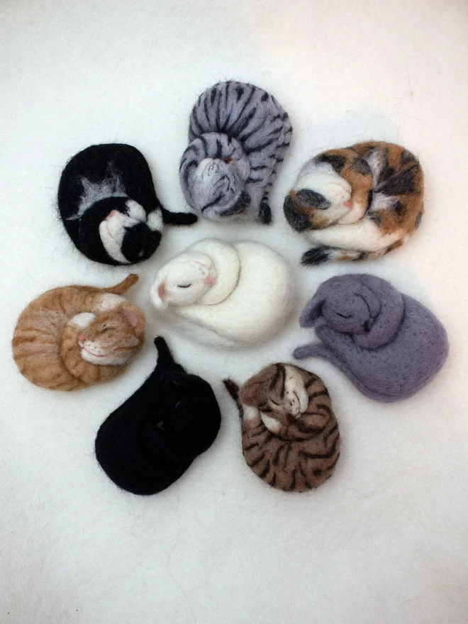 A selection of Needle-Felted Sleeping Cat Brooches 