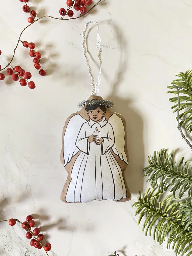 boy angel plush Christmas tree decoration illustration of a dark hair boy holding a candle