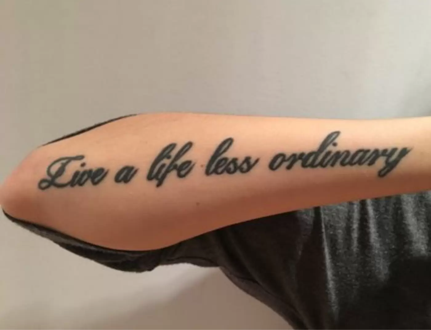 Live a life less ordinary tattoo