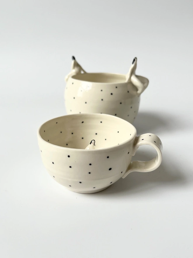  White Porcelain Cup With a Little Figure Sitting