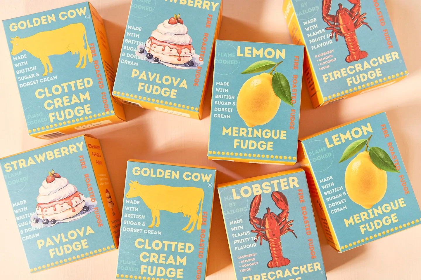 Fudge packets laid out on a pink background