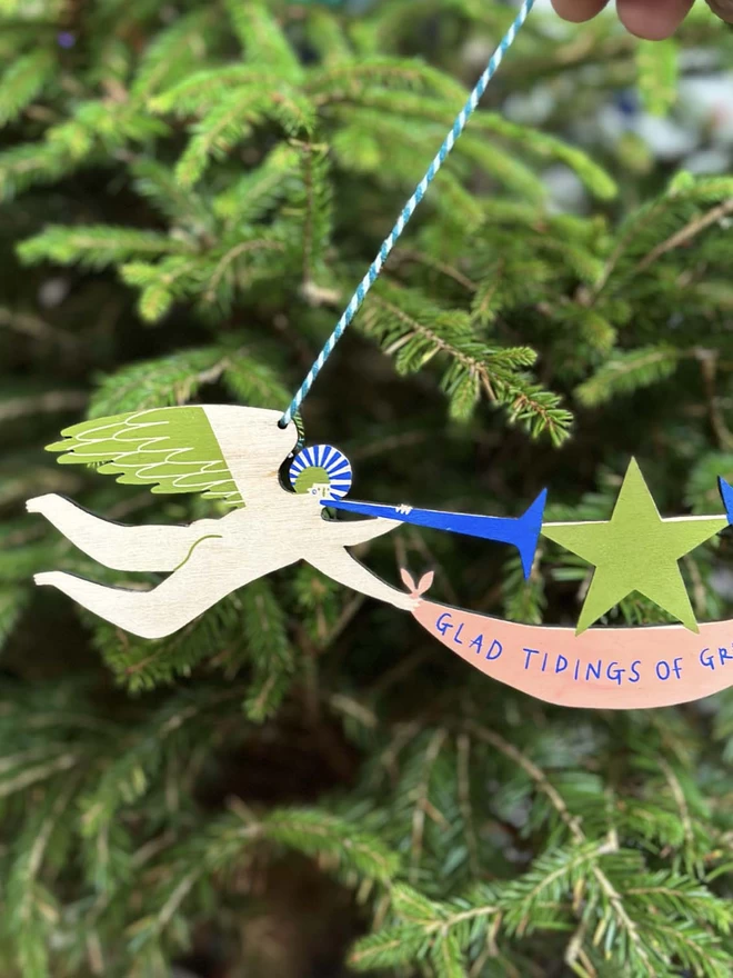 A detail of a blue angel on a christmas tree