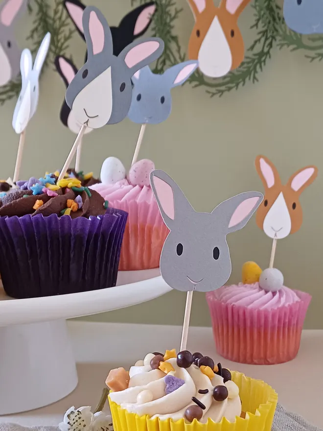 Pale grey east bunny cupcake decoration in cupcake on table decorated for easter 