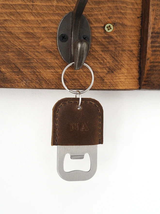 Personalised leather bottle opener key ring in rustic brown waxy leather.