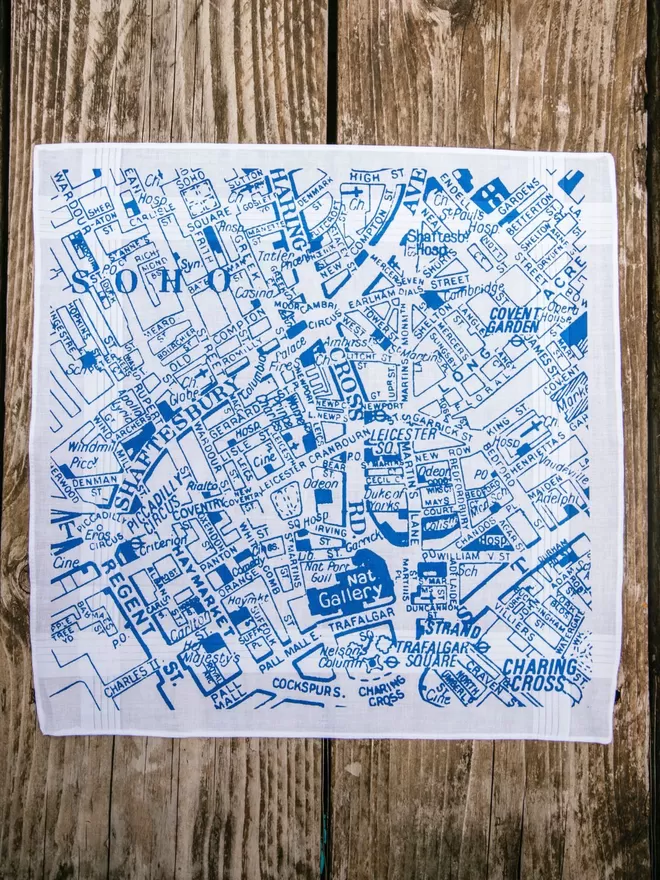 A Mr.PS Central London map hankie laid on a wooden table