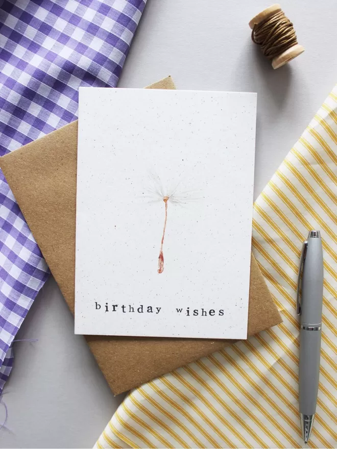 'Birthday Wishes' Card laying on Kraft envelope