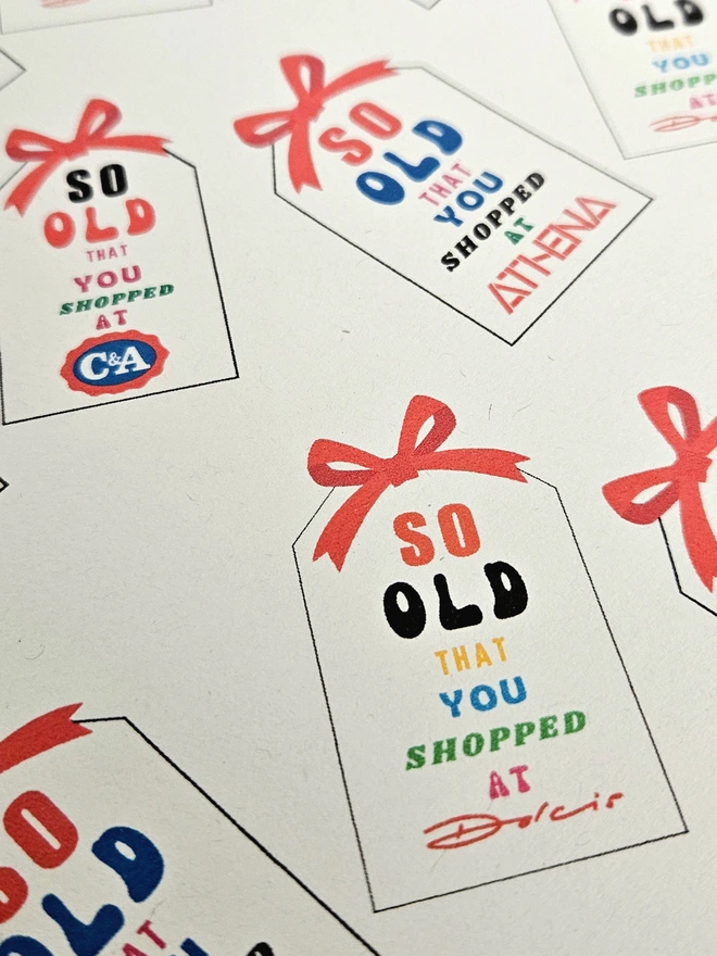 Wrapping paper design that says so old that you shopped at Woolworths, C&A, Sock Shop, Tie Rack, Athena the text is written in bright  multi colours .