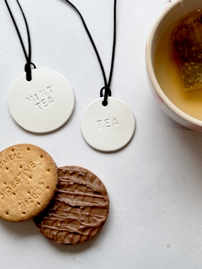 Minimalist white leather pantry tags with hand-stamped labels for kitchen storage. Rustic and stylish labels with black cord, ideal for home organisation and pantry décor.