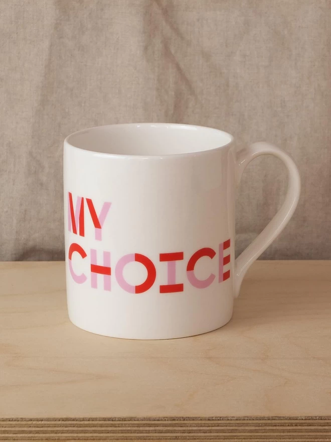 Black & Beech white mug with My Body written on one side and My Choice on the other in Pink and Red 