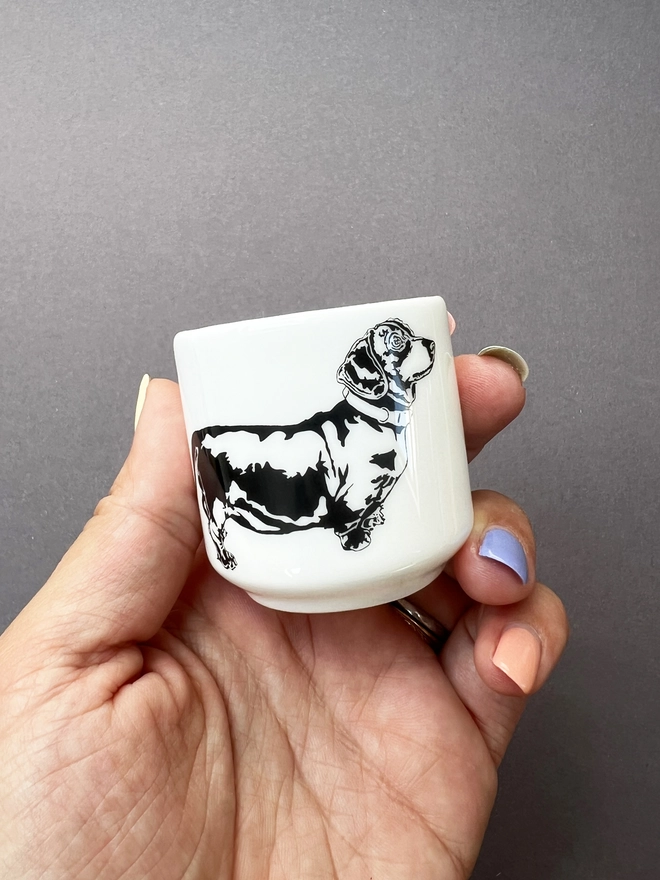 Dachshund straight sided egg cup in a hand 