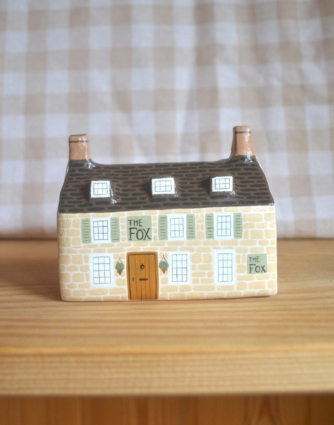 handmade ceramic sculpture in design of a pub