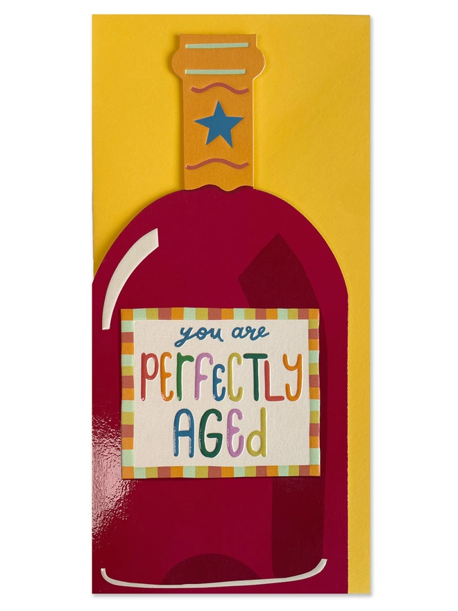 The vibrant Raspberry Blossom ‘You are perfectly aged’ card sits on a sunshine yellow envelope
