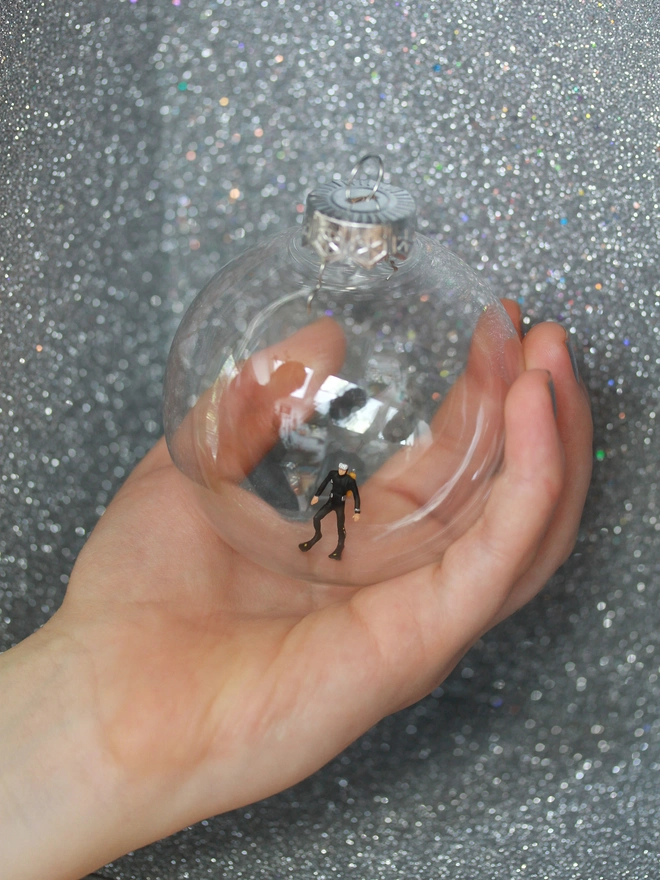 Christmas ornament in hand