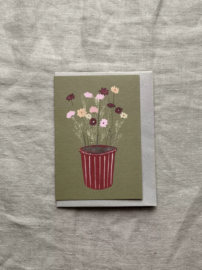 Greetings card with potted cosmos on. 