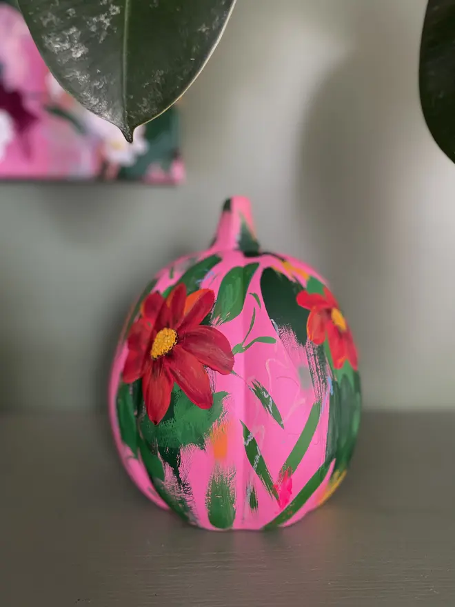 hand painted ceramic halloween floral pumpkin vibrant pink background bright red orange Mexican sunflowers