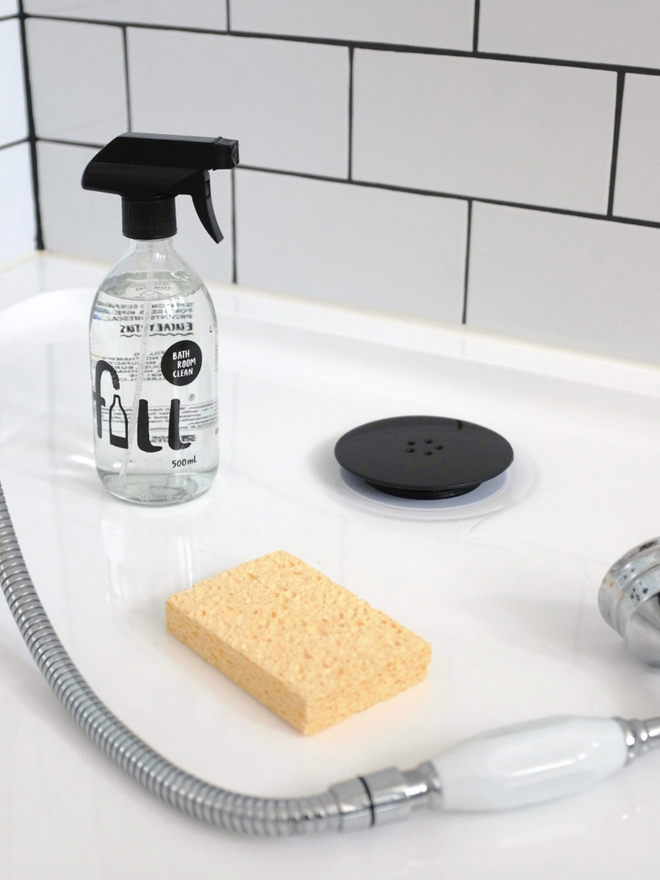 Bathroom Cleaner. A bottle with trigger spray of bathroom cleaner.
