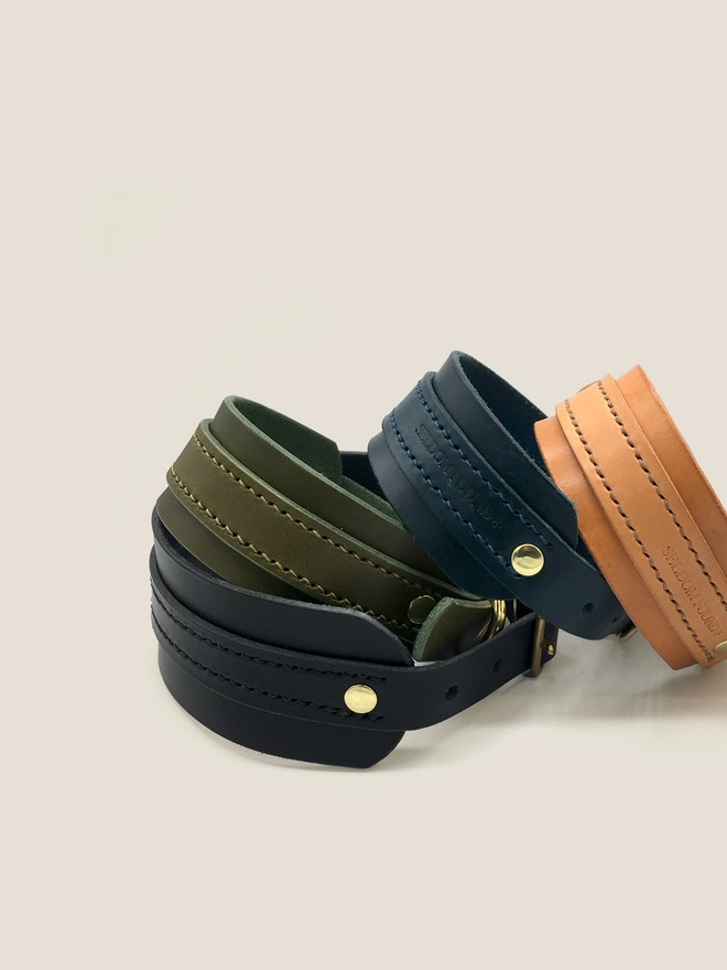 Four Leather Sighthound Collars Stacked