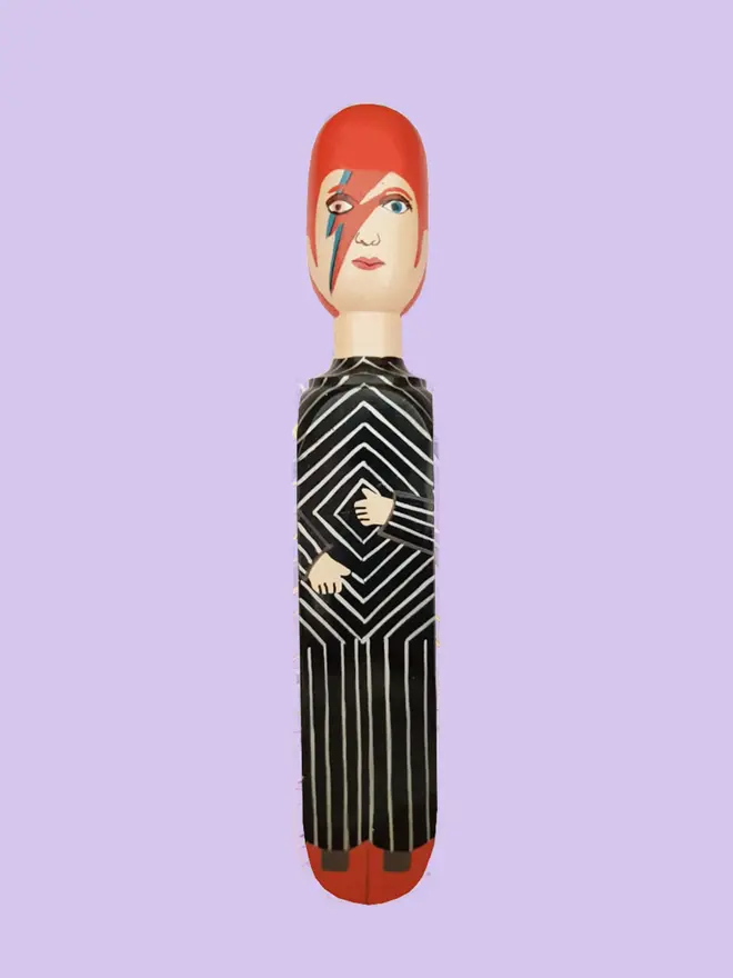 Wooden Door Stopper (major dave), a colourful wooden door stop sitting on a white surface. 