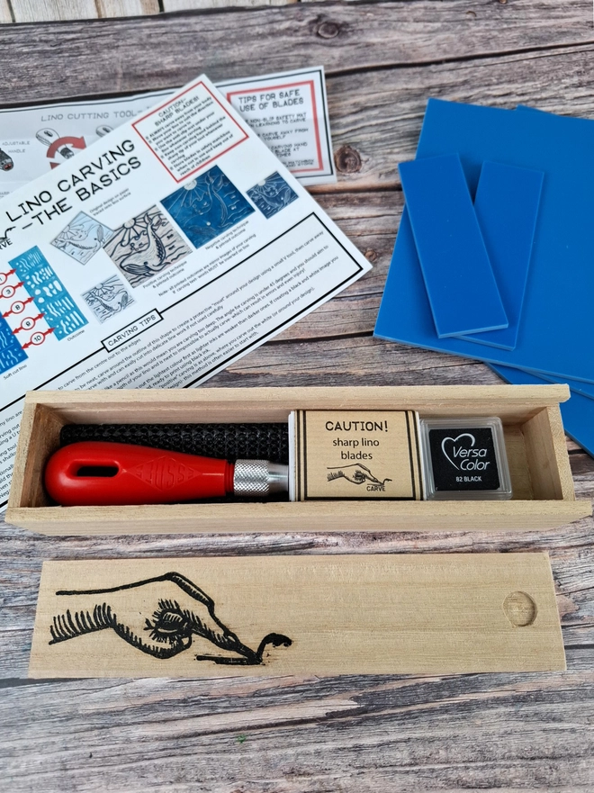 Lino carving and printing kit in wooden box with blue soft lino and versicolor ink pad