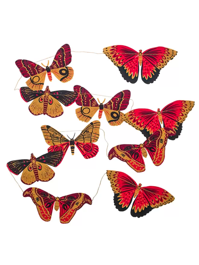 Full shot of image of all 10 pink and yellow butterflies laid out.