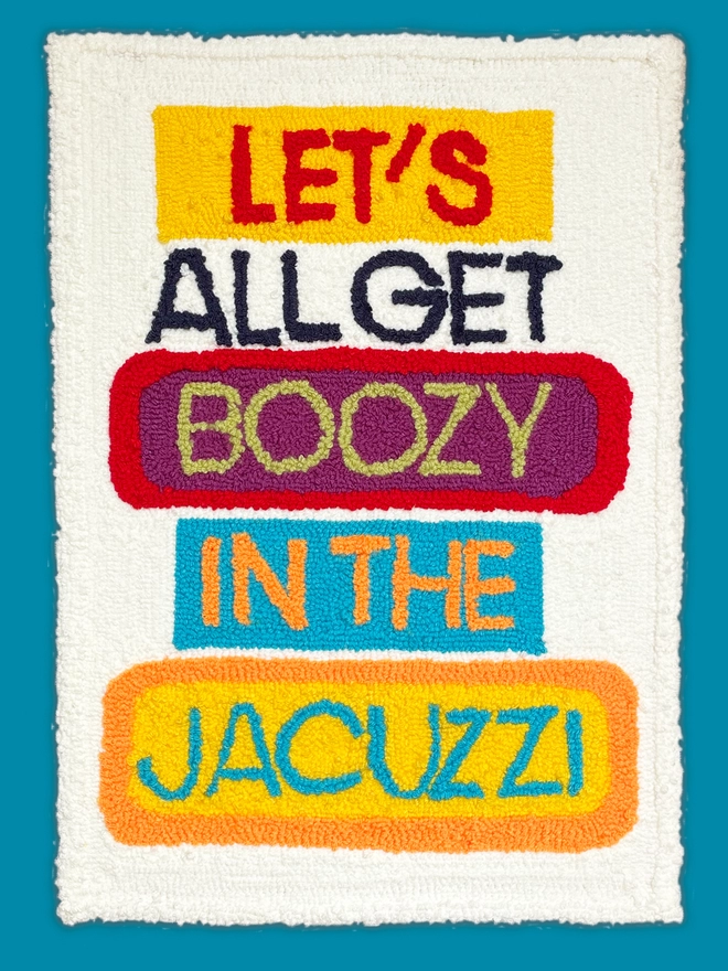 let's all get boozy in the jacuzzi textile art, bright letters on cream background
