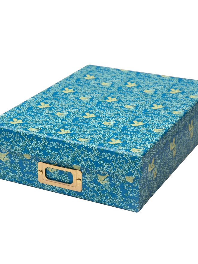 Corali Aqua Deeps Portfolio Box, a colourful portfolio sitting on a plan surface.