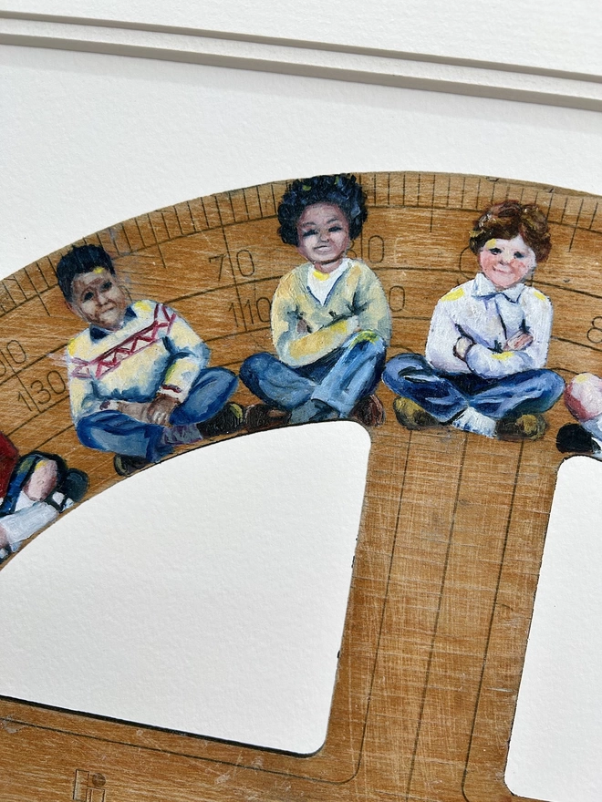 a small portion of the small world print showing three children sitting crosslegged