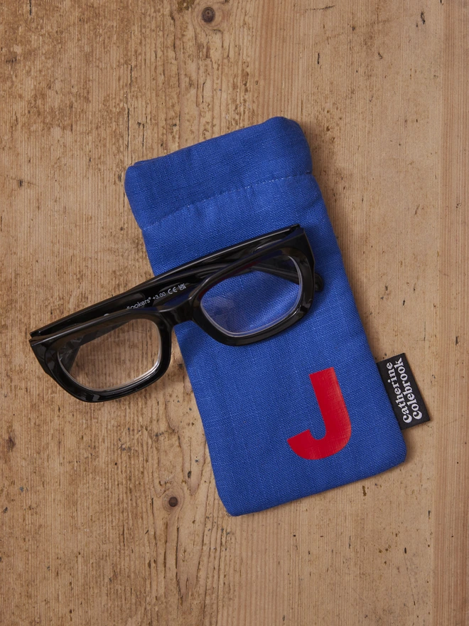 Royal blue personalised glasses case with red letter