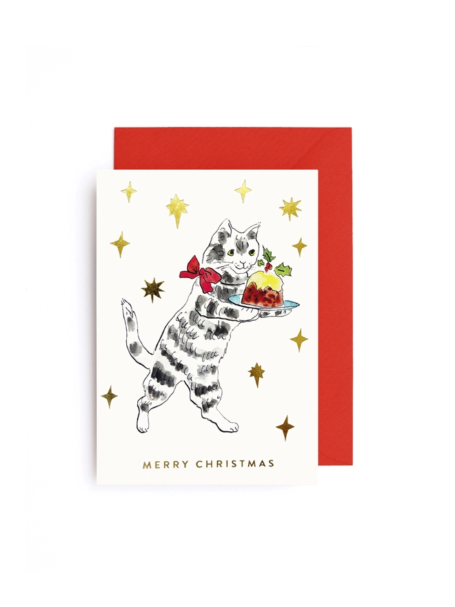 Christmas card set of 8 cards featuring a cat carrying a festive Christmas pudding surrounded by gold foil stars and red envelope.