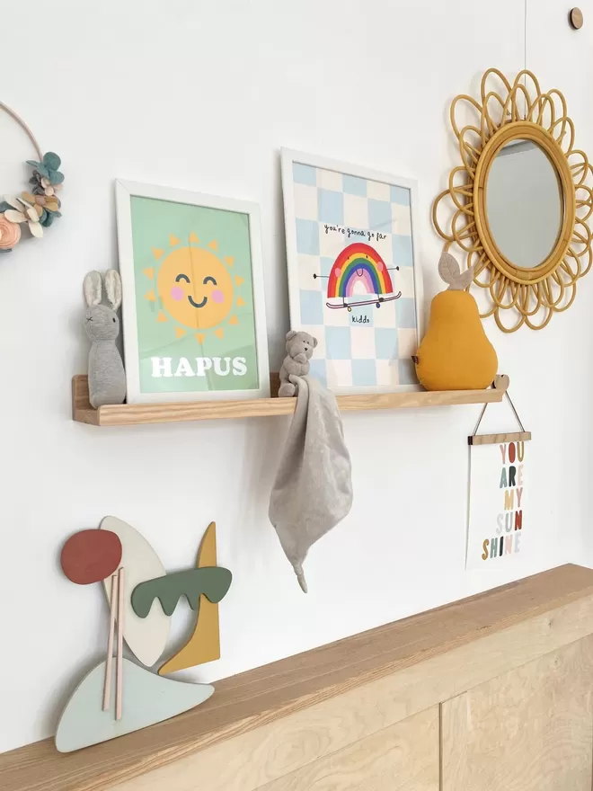 Autumn's Corner solid wood picture ledge, styled up with kids prints and teddies