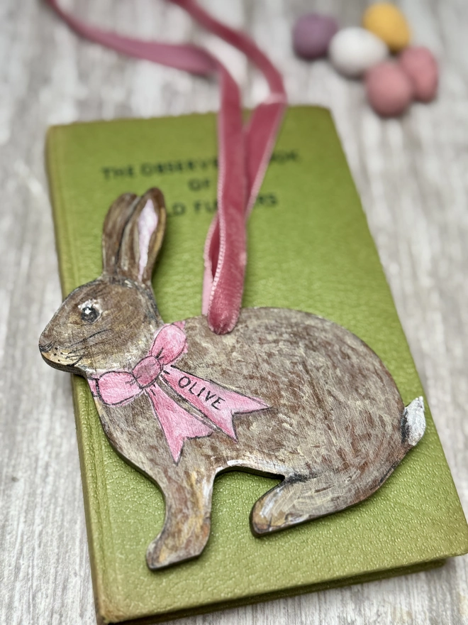 Easter Bunny Decoration with the name Olive  and a pink velvet ribbon to hang