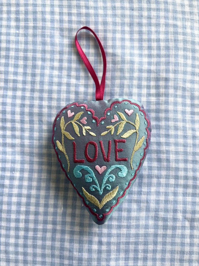 "LOVE" heart silk ornament with hearts, leaves and a scalloped edge (Pale blue silk with dusty pink, pastel pink, pastel green and turquoise thread with a pink ribbon)