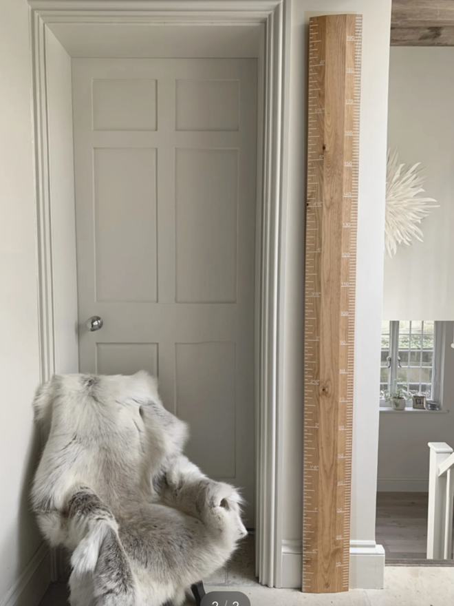 Original White Ruler Height Chart. A wooden height chart with painted white detail.