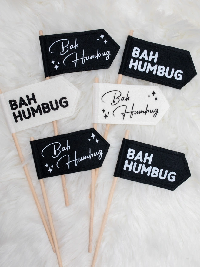 Black and white felt flags with glittery text that read "Bah Humbug"