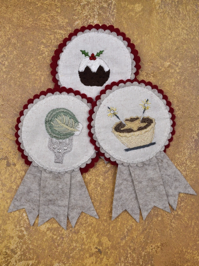 3 Felt Rosettes with embroidered designs.  Christmas Pudding, Brussels Sprout and Mince Pie.