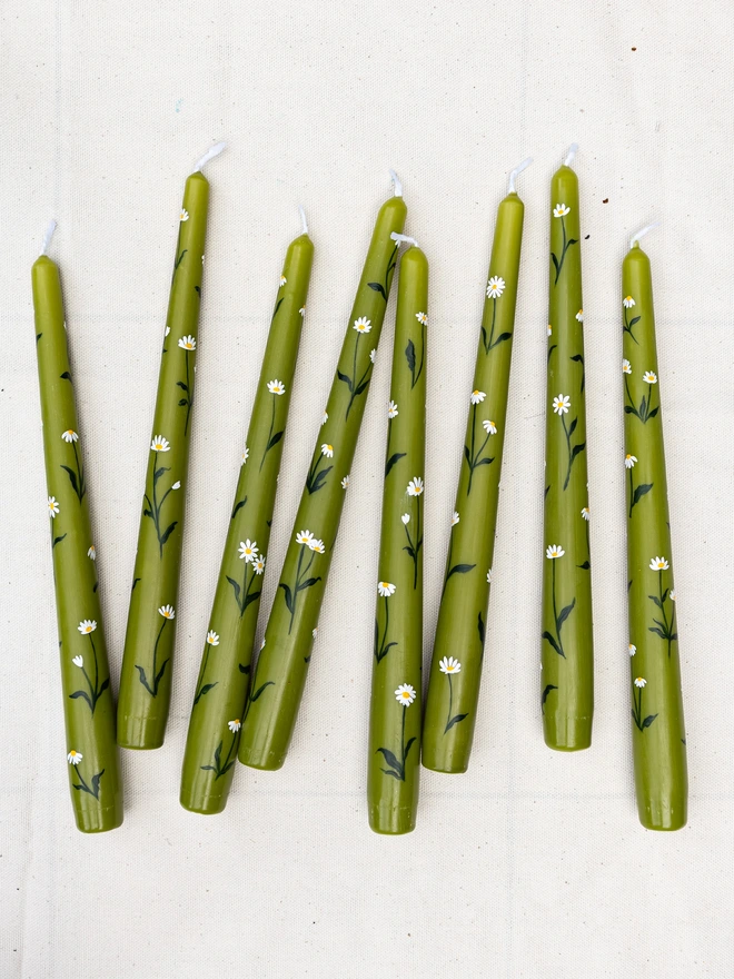 Olive green candles with hand painted daisies
