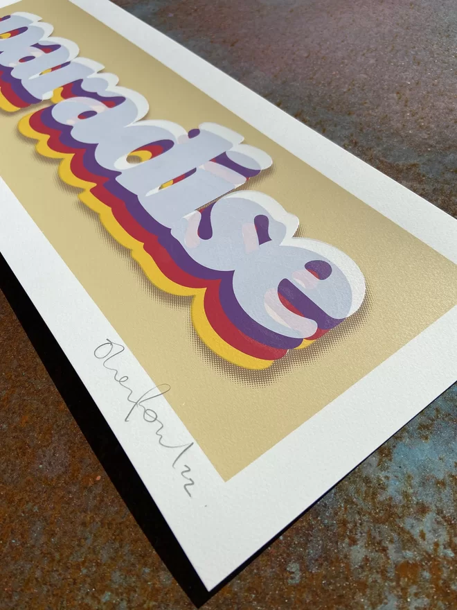  "Paradise" Cream Handpulled Screenprint rectangular with cream background and the word paradise printed on top in rainbow letters includes a drop shadow 