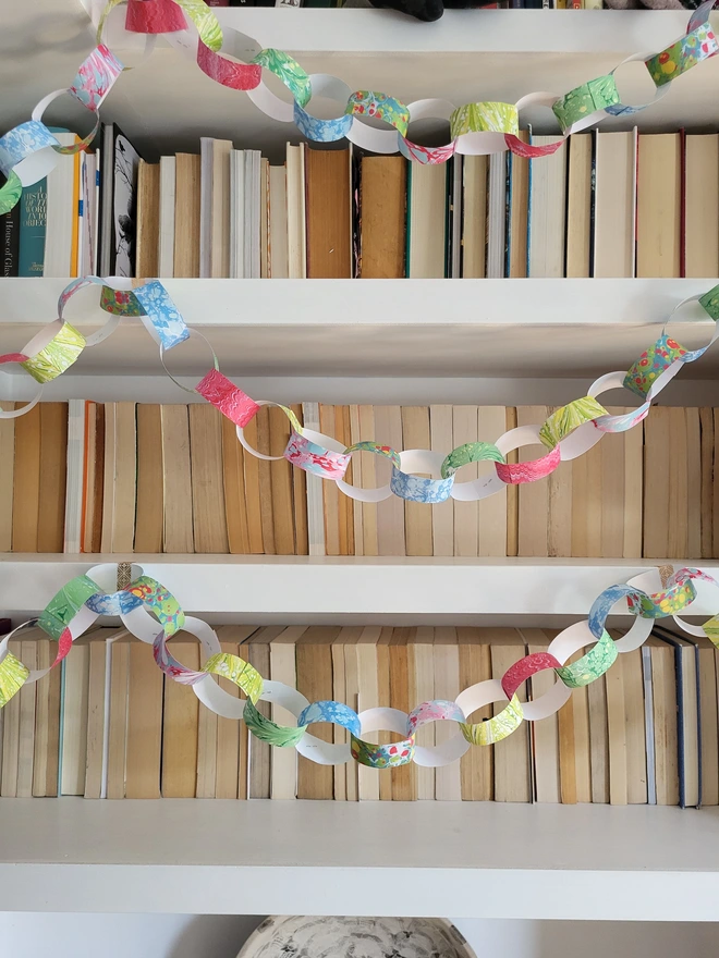 marbled paper chains looping along bookshelves
