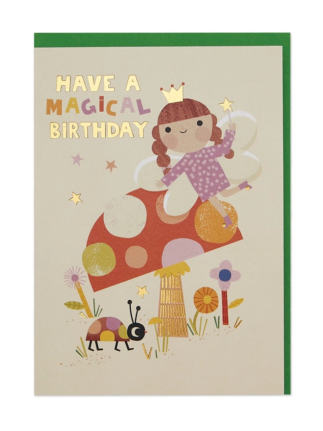 Raspberry Blossom Children’s Birthday card featuring a vibrant illustration of a fairy on a toadstool surrounded by stars, flowers and a colourful ladybird. The design has special gold foil details and a ‘Have a magical Birthday' message