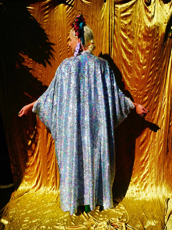 Silver Holographic Sequin V-neck Kaftan Gown seen from the back.