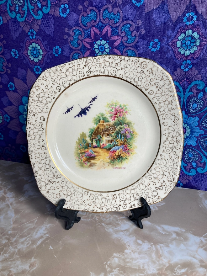 Vintage plate featuring a rural scene with a Chinook Helicopter flying overhead.