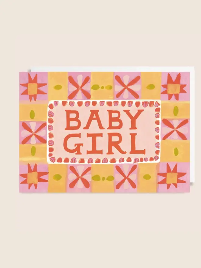 'Baby Girl' New Baby Card, against a pink background. 