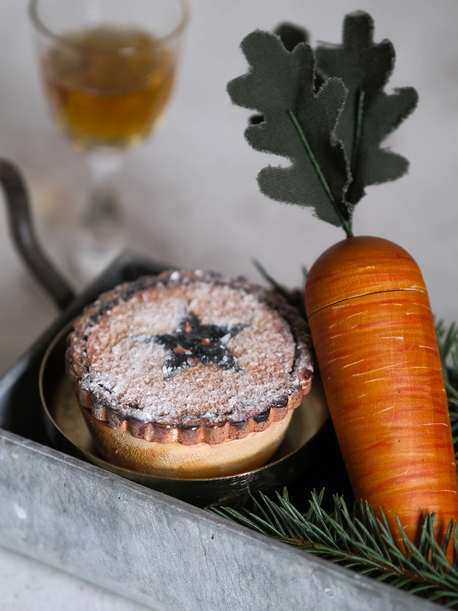 A festive handpainted wooden mince pie designed to become part of your family’s Christmas Eve tradition, with a special place for a note to Santa.